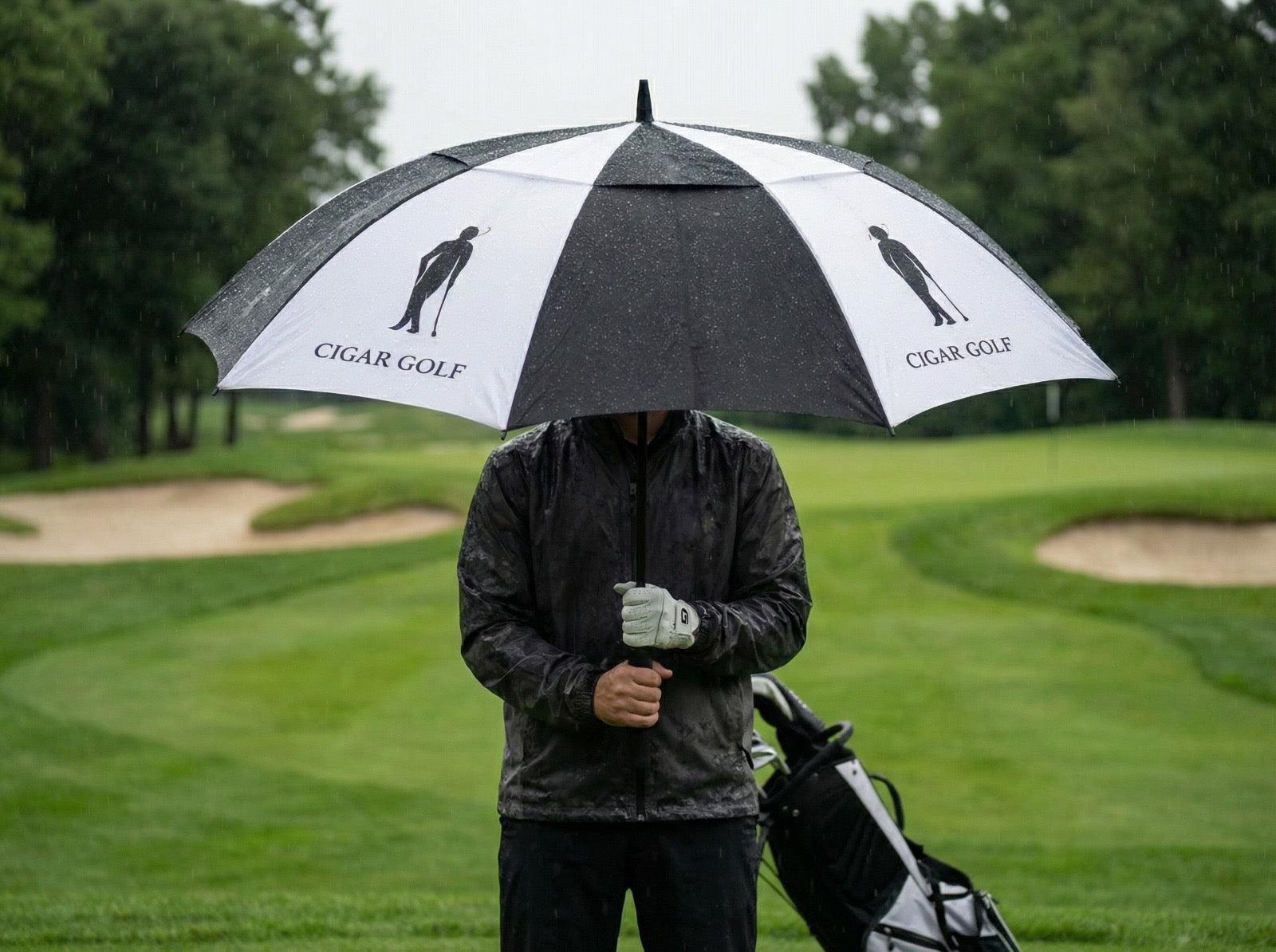 Cigar Golf double-canopy tour umbrella on the course in the rain