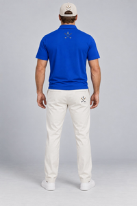 The Royal Approach Polo in royal blue, back view with crossed cigar and golf club emblem
